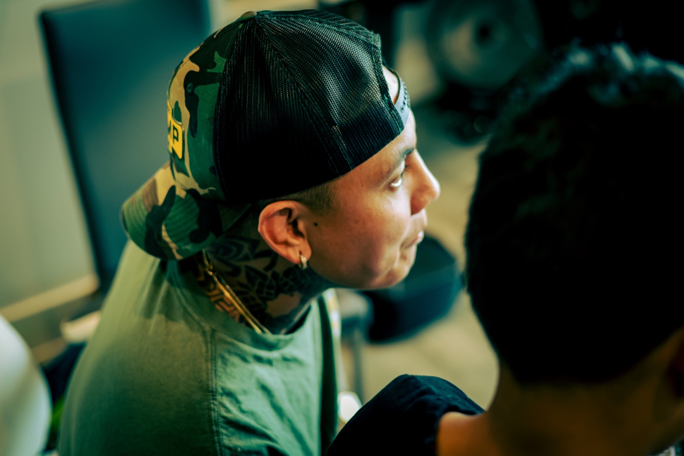 Vince in profile, listening to his student's mix
